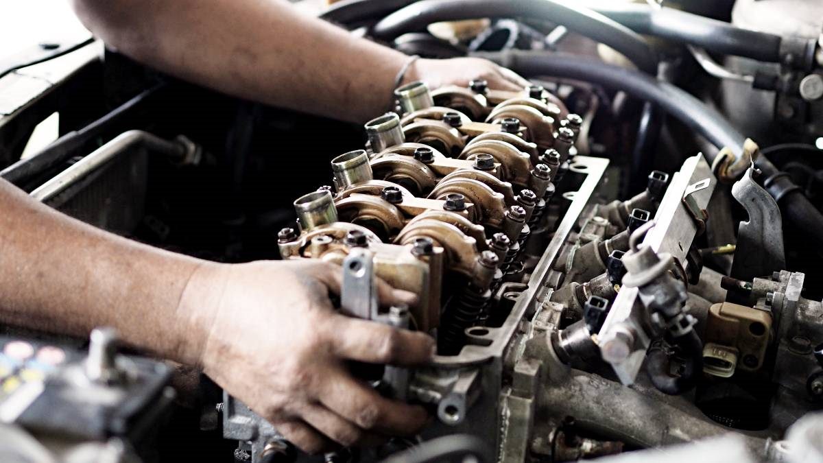 Hands assembling a valvetrain